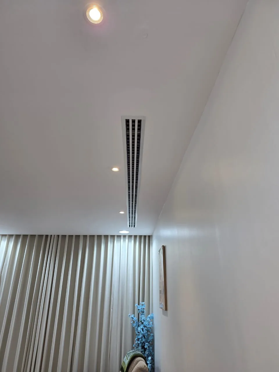 Finished linear slot diffuser connected to the air-conditioning duct system