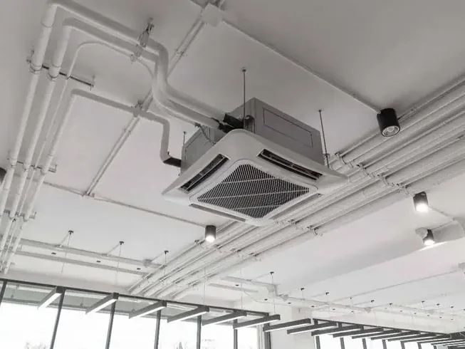 Ceiling cassette air conditioner installed in an open commercial space